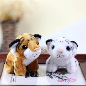 Detail of plush tiger keychains with realistic whiskers and soft fur textures