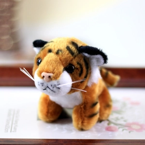Detailed view of plush tiger toy featuring realistic white whiskers and black stripes