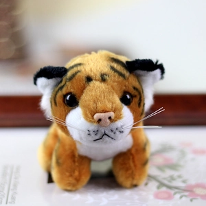 Close-up of soft plush tiger toy showing realistic fur texture and whiskers detail