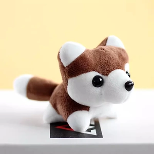 Close-up of a plush husky keychain showing soft brown and white fur textures