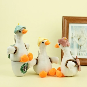 Three plush duck keychains in coffee cup scene with green, yellow and red hats