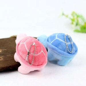 Pink and blue mini plush sea turtle keychains with silver chains and shell stitching