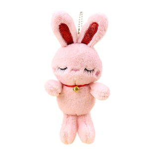 Cute pink plush bunny keychain with long soft fur, closed eyes, and golden bell