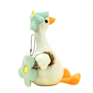 Cute white plush duck keychain with a green beret and floral bag charm for backpacks