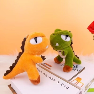 Cute green and orange plush dinosaur keychain charms for bags with golden chains