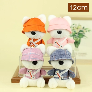 Four 12cm plush bear keychains in colorful hats and crossbody bags on a warm background