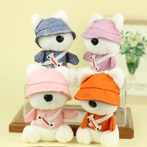 Cute cartoon plush dog keychains set in four colorful outfits with matching bucket hats