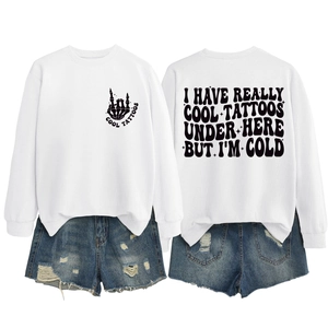 Front and back detail of white sweatshirt with vintage text and denim shorts outfit