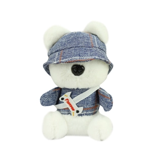 Cute white plush dog keychain wearing blue plaid hat and shirt with Freedom bone accessory