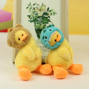Detail of plush yellow ducks wearing bear and dinosaur hoods with metal chains
