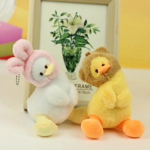 Detail of plush duck charms featuring pink rabbit and brown bear hoodies with bead chains