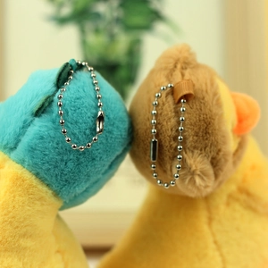 Close-up of soft plush duck keychain textures and silver bead chain details