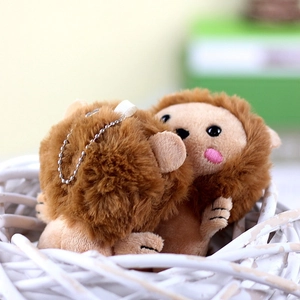 Pair of cute plush hedgehog keychains in a white basket with a soft warm aesthetic