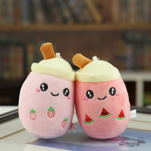 Detailed plush milk tea keychains featuring strawberry and watermelon embroidery patterns