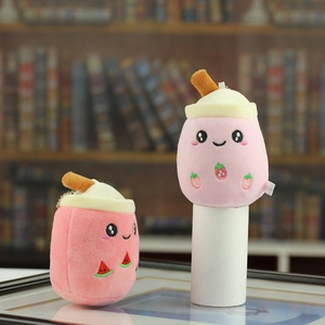 Close-up of plush milk tea cup pendants with strawberry and watermelon embroidery