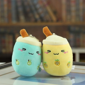 Close-up of fruit-themed bubble tea plush keychains with green and yellow embroidery