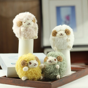 Set of four cute curly plush sheep charms in pink, white, yellow, and green colors