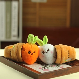 Close-up of cute plush carrot and radish toys in flower pots with Radish embroidery