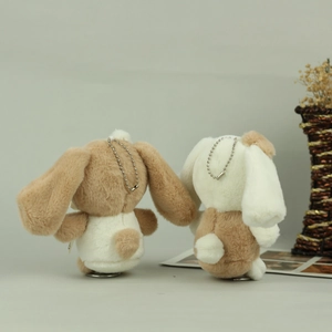 Close-up of soft plush Cinnamoroll charms with curly tails and silver bead chains
