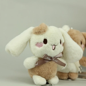 Detail of plush bunny charm with soft fur textures and a Just for you satin ribbon bow