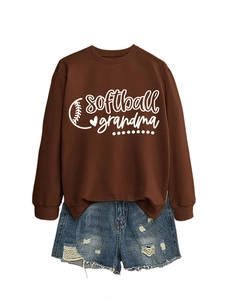 Close-up of brown sweatshirt featuring white softball grandma print and baseball stitching