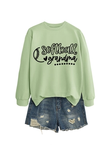Detail of light green sweatshirt with softball grandma print and denim shorts outfit