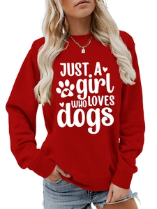 Close-up of red crewneck sweatshirt with Just A Girl Who Loves Dogs print and paw details