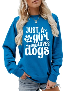 Close-up of blue crewneck sweatshirt featuring white Just a girl who loves dogs print