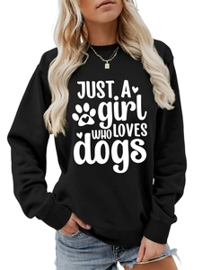 Detailed close-up of a black crewneck sweatshirt with 'JUST A girl WHO LOVES dogs' print