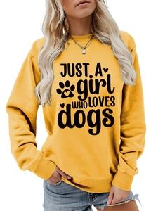 Close-up of mustard yellow sweatshirt with Just a girl who loves dogs print and ribbed cuff