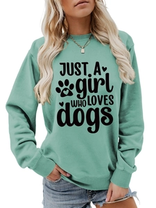 Detail of mint green sweatshirt featuring Just a girl who loves dogs print and ribbed cuffs