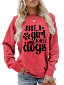 Detail of red crewneck sweatshirt with 'JUST A girl WHO LOVES dogs' graphic print
