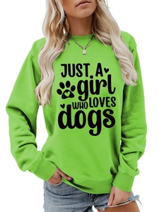 Close-up of vibrant lime green sweatshirt featuring black Just a girl who loves dogs print