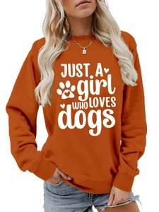 Detail of ribbed cuffs and Just A Girl Who Loves Dogs print on orange sweatshirt