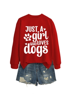 Flat lay of a red women's sweatshirt with Just a Girl Who Loves Dogs print and denim shorts