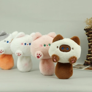 Detailed view of four colorful plush cat pendants with soft fur and embroidered paws