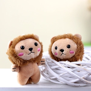 Cute lion plush keychain with pink blush in a decorative basket on light background