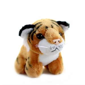 Cute plush tiger toy with orange fur and black stripes in a sitting position