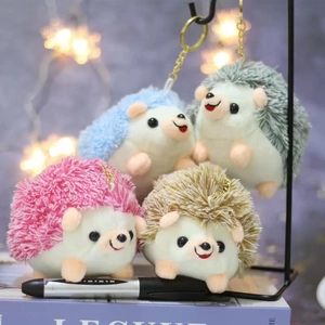 Cute plush hedgehog keychains in pink, blue, gray and brown colors with metal rings