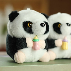 Macro shot of plush panda pendant holding a colorful milk bottle with soft fur texture