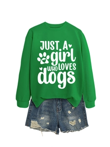 Detail of green crewneck sweatshirt with 'JUST A girl WHO LOVES dogs' print and denim shorts