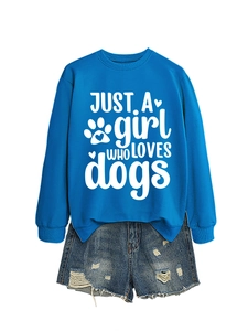 Close-up of royal blue dog print sweatshirt paired with distressed denim shorts