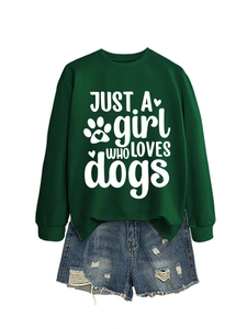 Flat lay of dark green dog lover sweatshirt with distressed blue denim shorts