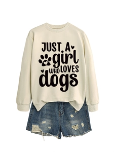 Detail of cream sweatshirt with JUST A girl WHO LOVES dogs print and frayed hem