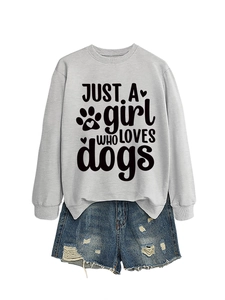 Flat lay of gray sweatshirt with dog lover print and distressed denim shorts set