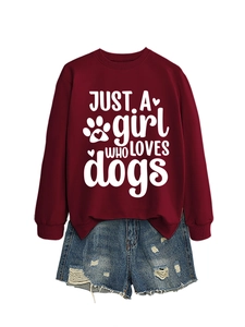 Detail of dark red crewneck sweatshirt with 'Just a Girl Who Loves Dogs' white print