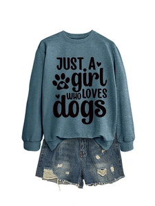 Detail of blue crewneck sweatshirt with 'JUST A girl WHO LOVES dogs' print and denim shorts