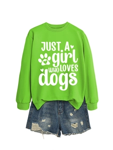 Close-up of ribbed cuffs on green dog lover sweatshirt and distressed denim shorts