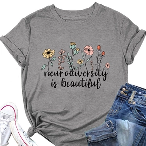 Flat lay of gray T-shirt with neurodiversity is beautiful floral text and casual outfit