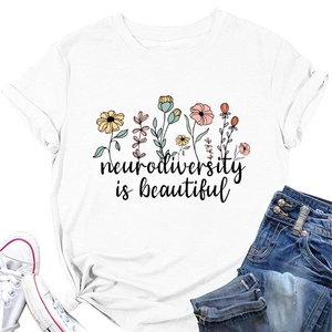 White cotton t-shirt featuring floral neurodiversity is beautiful print with denim shorts